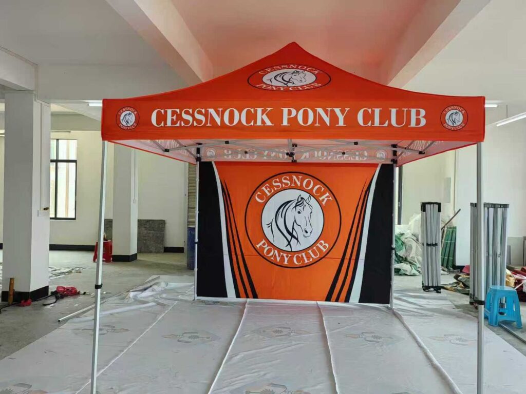 Custom canopy tent with printed back wall