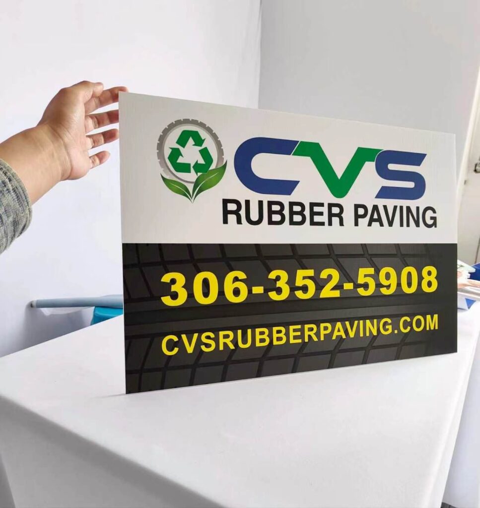 Corrugated plastic yard sign held in hand