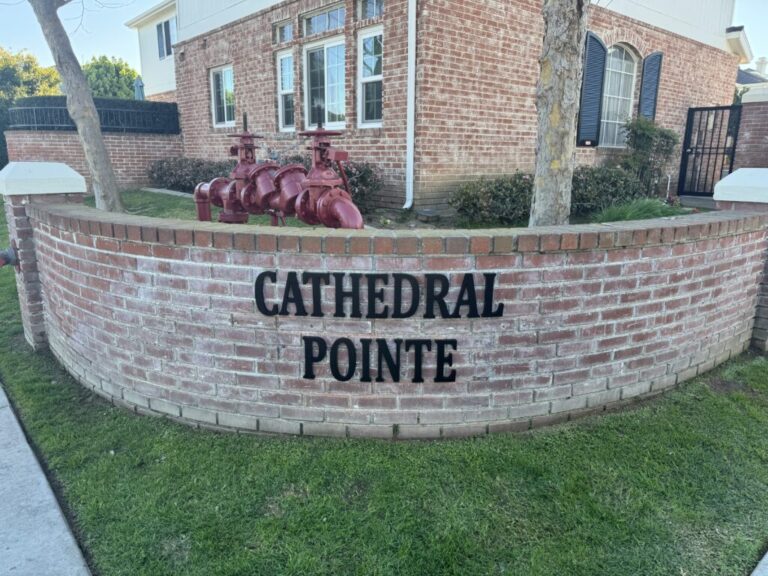 Cathedral Pointe stainless steel letters on a stone monument