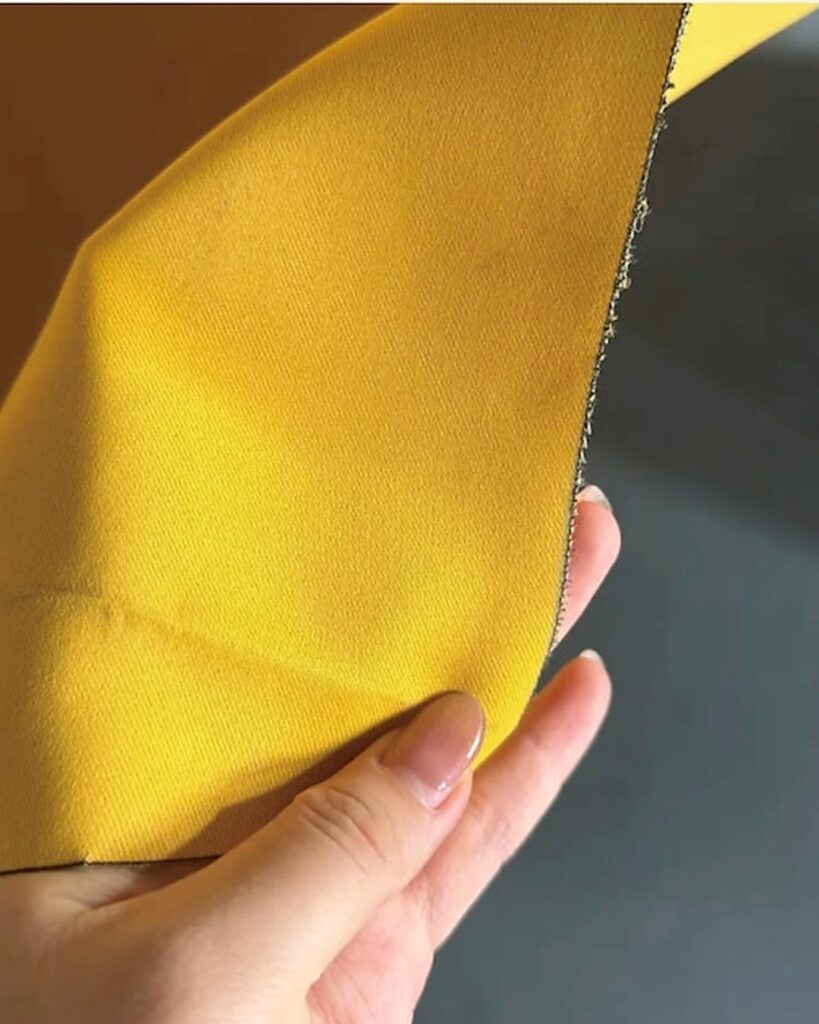 Close-up of feather flag fabric and stitched edge