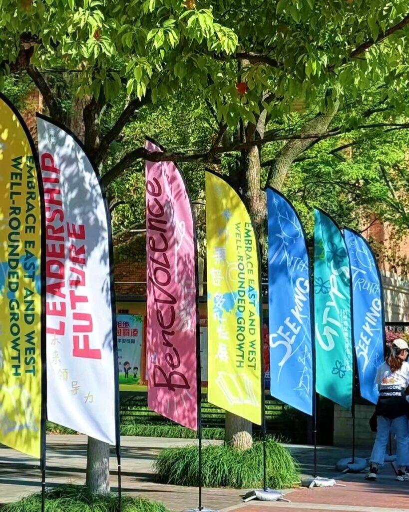 Row of custom printed feather flags outdoors